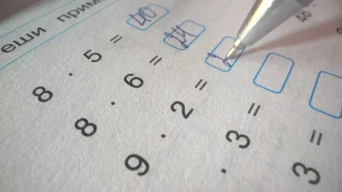The sign "solve an example". Student solves equations in mathematics. School Stock Footage 141242396