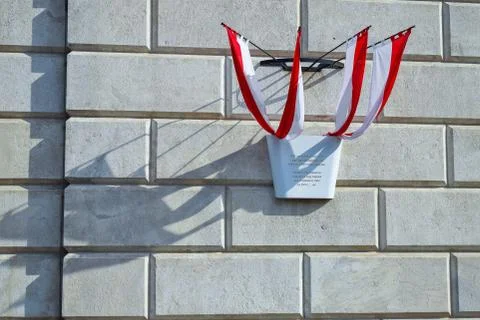 Sign of state with four flags with shadows on background of wall of bricks Stock Photos