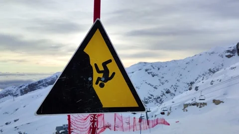 Sign symbol of the danger of falling off the cliff of the mountains Stock Footage 230178260