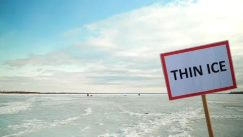 The sign "Thin Ice" prohibits going on the ice. Stop, danger, warning. Stock Footage 236554507