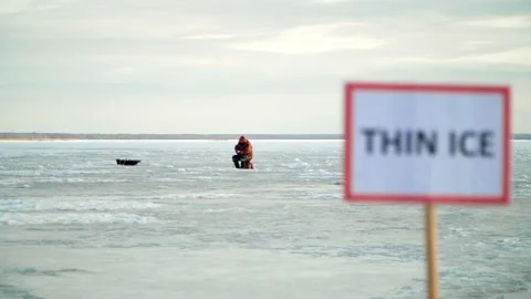 The sign "Thin Ice" prohibits going on the ice. Stop, danger, warning. Stock Footage 236554571