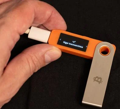 Sign transaction message on hardware Bitcoin wallet Stock Photos