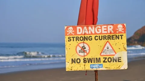Sign warning about the danger of swimming Stock Footage 265876905