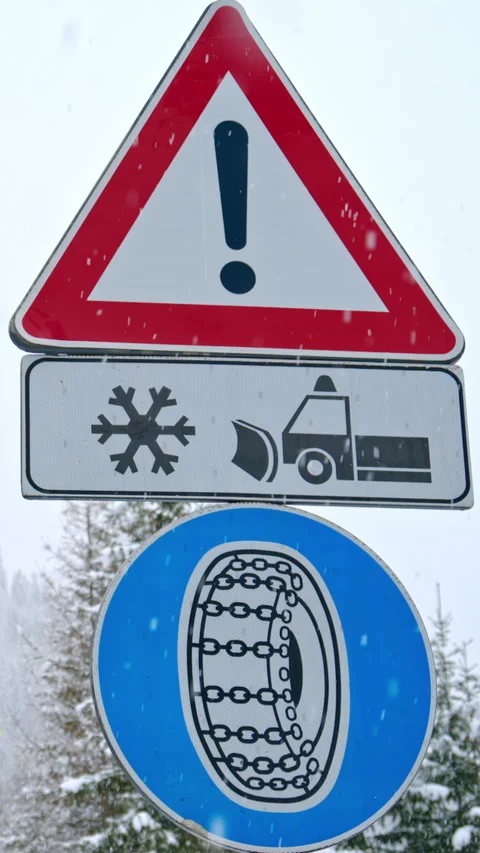 Sign warning drivers about hazardous winter road conditions, enforcing the use Stock Footage 304400959