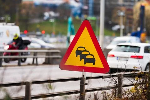 Sign warning for risk for queues. Stock Photos