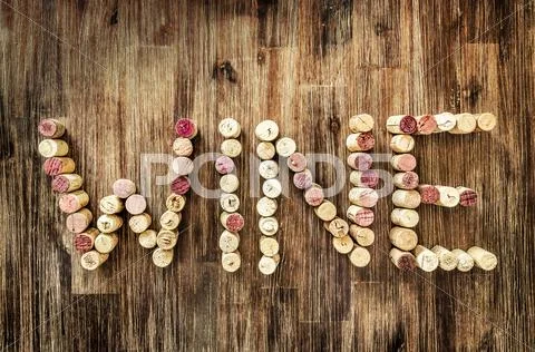 Sign wine made from corks on wooden vintage table Stock Photos