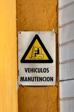 A sign with a yellow Stock Photos