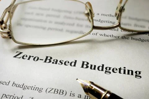 Sign Zero-Based Budgeting - ZBB on a paper and glasses. Stock Photos