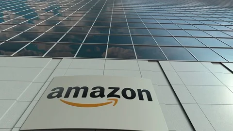 Signage board with Amazon.com logo. Modern office building facade time lapse Vídeos de archivo 77825260