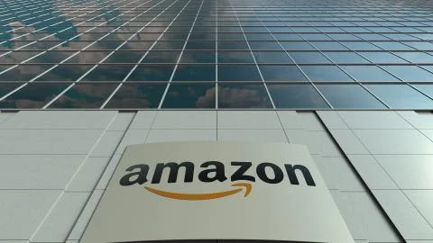 Signage board with Amazon.com logo. Modern office building facade. Editorial 3D Ilustración de archivo