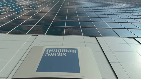 Signage board with The Goldman Sachs Group, Inc. logo. Modern office building Stock Footage