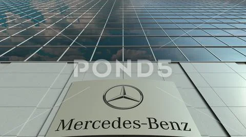 Signage board with Mercedes-Benz logo. Modern office building facade. Editorial Stock Illustration