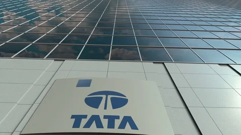 Signage board with Tata Group logo. Modern office building facade time lapse Stock Footage