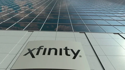 Signage board with Xfinity logo. Modern office building facade time lapse Stock Footage