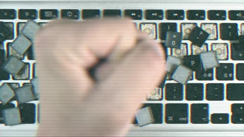 Signal interference punch breaking the keys of a keyboard Stock Footage 130317886