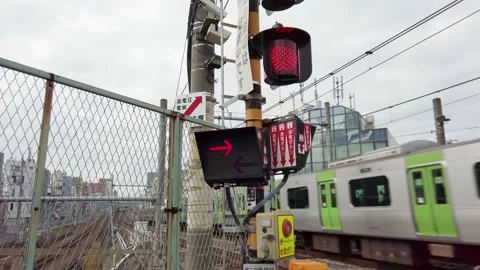 Signal lights flashing when approaching a train on Yamanote level crossing. Stock Footage 166303575