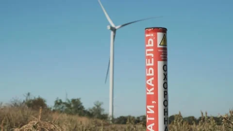 Signal pole against the background of a wind generator. Video stock 141601906