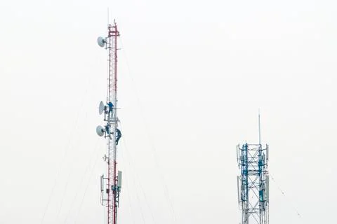 Signal tower communication and antenna maintenance working worker Stock Photos