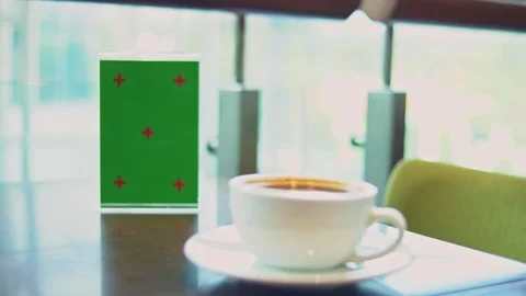 Signboard with green screen on table in caf Stock Footage 104269380