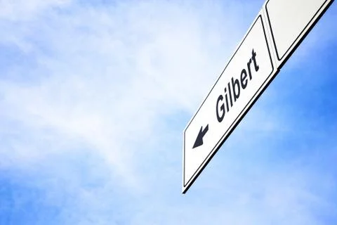 Signboard pointing towards Gilbert Stock Photos