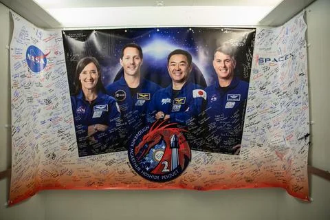 A signed banner hangs in the elevator inside the Astronaut Crew Quarters at.. Stock Photos