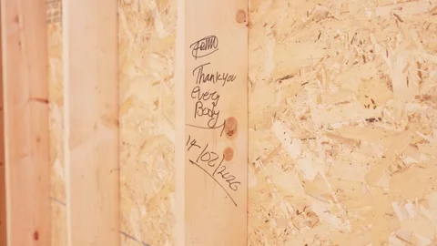 Signed Construction Beam Inside Habitat for Humanity Home Under Construction Stock Footage 345237565
