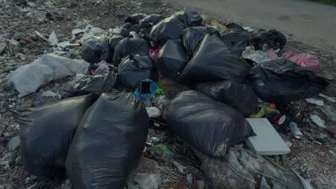 A significant accumulation of various types of trash and bags clearly indicating Stock Footage 311591172