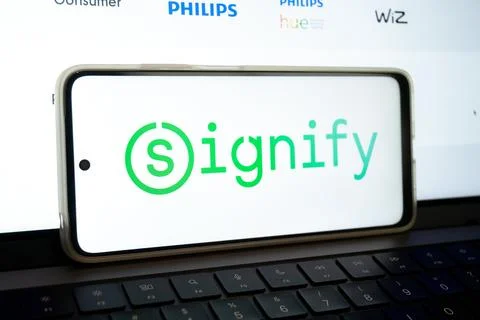 Signify logo on smartphone displaying smart lighting brands Stock Photos