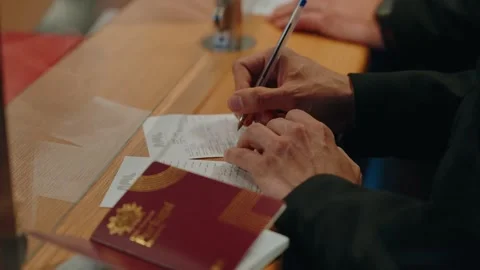 Signing An Arrival Form Beside A Passport At Border Immigration Control Stock Footage 340595708