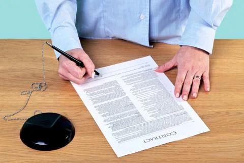 Signing a contract Stock Photos