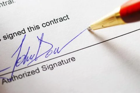 Signing a contract Stock Photos