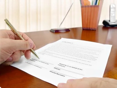 Signing a Contract Stock Photos
