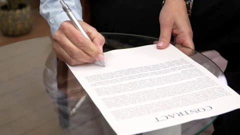 Signing a Contract with Precision: Capturing Moments of Commitment 動画素材 300669202