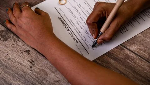 Signing Divorce Papers Stock Photos