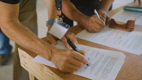 Signing a Document for Construction Stock Footage 128656408