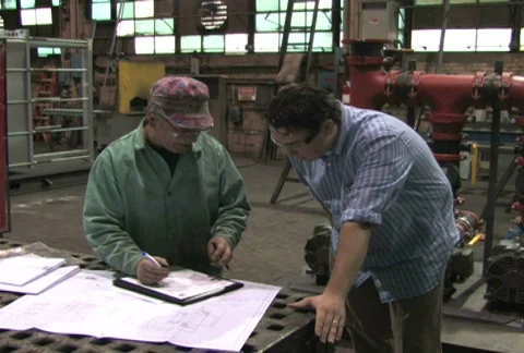 Signing Document in Factory Stock Footage 285202