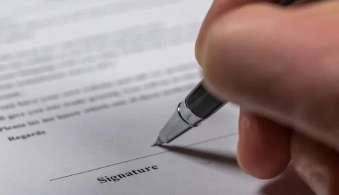 Signing on document 写真素材