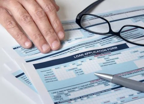 Signing the loan application Stock Photos