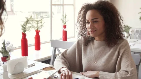 Signing on tablet PC by young afro woman by finger. May depict third Party IP Stock Footage 72651287