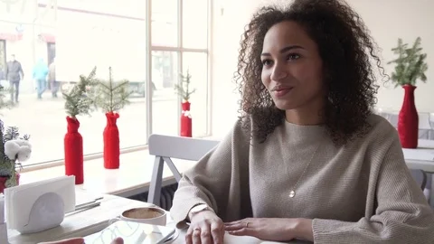 Signing on tablet PC by young afro woman by finger. May depict third Party IP Stock Footage 72651442