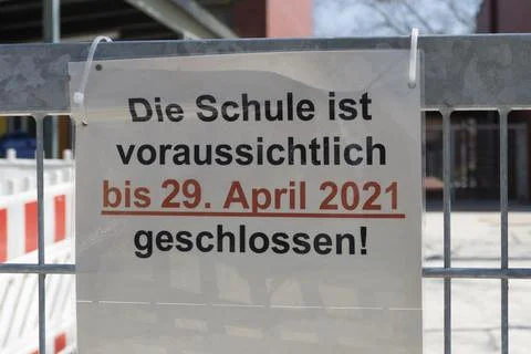 Signpost of a closed school Stock Photos