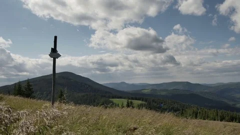 Signpost of hiking trails indicating the direction on the background of mountain 스톡 동영상 77606745