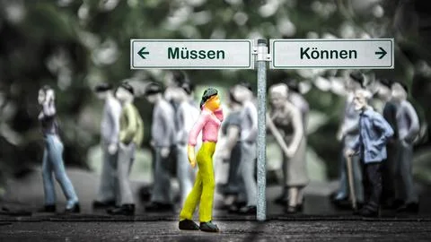 Signposts the direct way to ability versus necessity Stock Photos