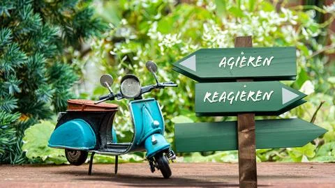 Signposts the direct way to Act versus React Foto stock
