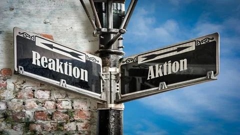 Signposts the direct way to Action versus Reaction Foto stock