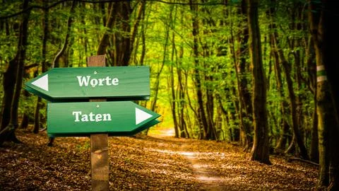 Signposts the direct way to Actions versus Words Stock Photos