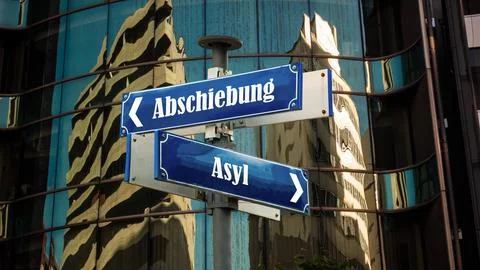 Signposts the direct way to Asylum versus Deportation Фото