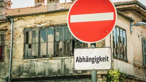 Signposts the direct way to Autonomy versus Dependency Stock Photos
