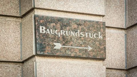 Signposts the direct way to building plot 스톡 사진