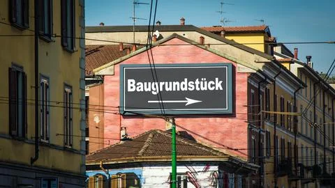 Signposts the direct way to building plot Stock Photos